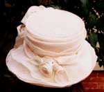 Wedding Cake like confection in sculpted pink sinamay!
